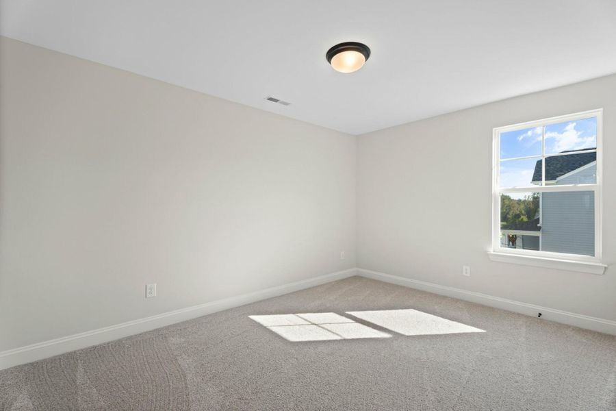 Spacious, unfurnished interior of a new home in Cottages at Piper Village, Trinity (Image 26).