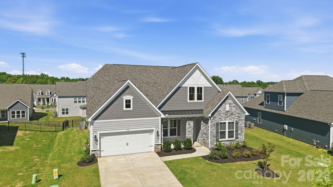 Front exterior of a new home in Estates at Sugar Creek, Indian Land, SC, highlighting curb appeal (Image 27).