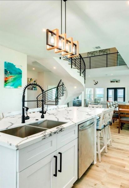 Easily serve meals to the adjacent dining table, or pull up a seat at the island seating 8