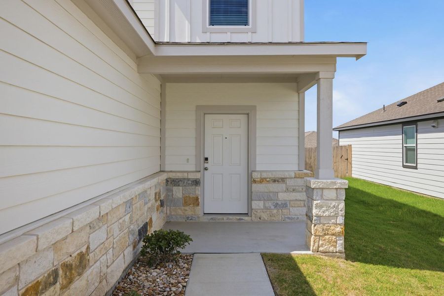 Exterior details and patio area of a home in Stallion Run, Buda (Image 29).
