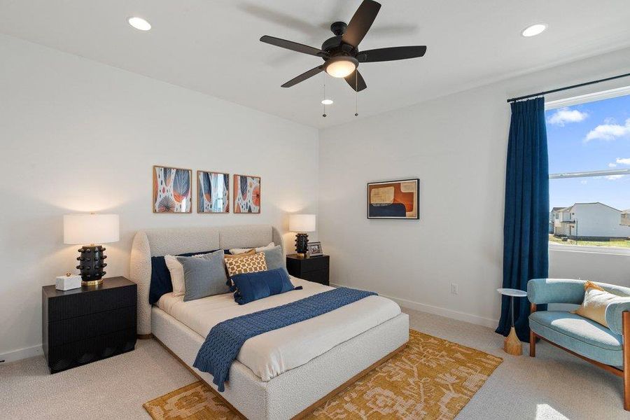 Bedroom featuring a large window, recessed lighting, and a ceiling fan