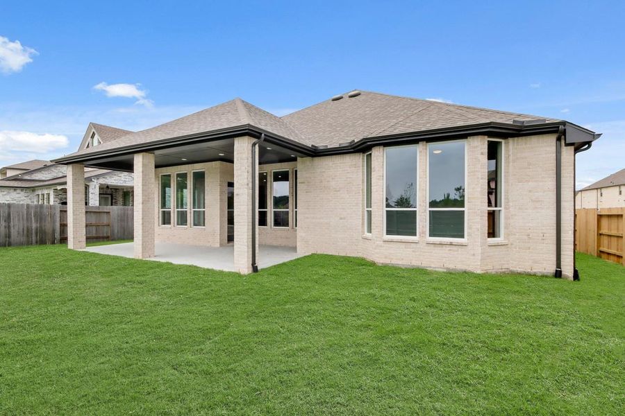 Exterior details and patio area of a home in ARTAVIA, Conroe (Image 19).