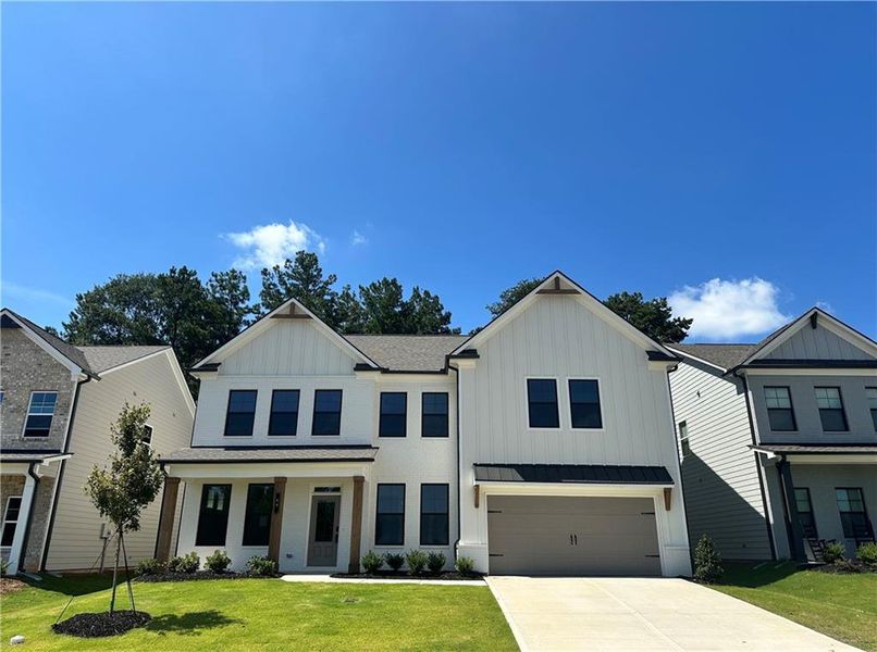 Front exterior of a new home in Summerlin, Winder, GA, highlighting curb appeal (Image 28).