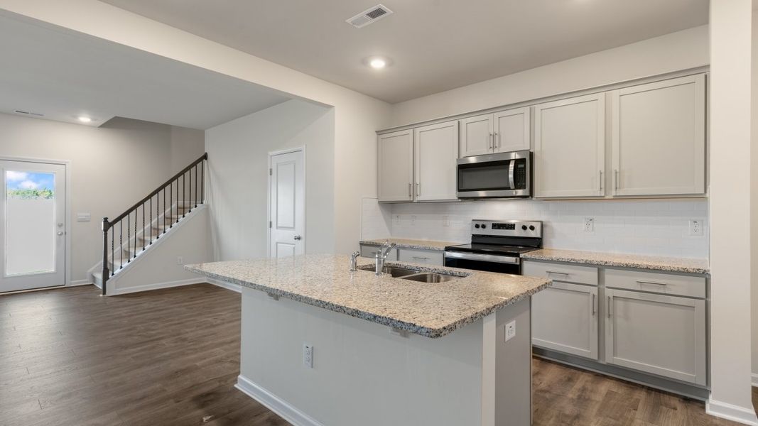 Furnished interior view inside a new home in The Grove at Matthews Landing, Fuquay Varina (Image 6).
