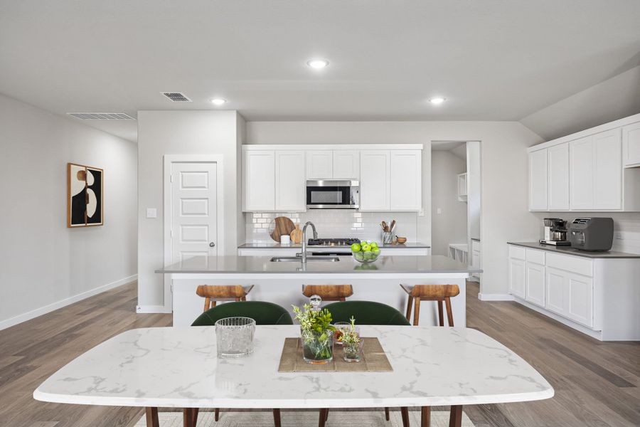Kitchen in the Heisman home plan by Trophy Signature Homes – REPRESENTATIVE PHOTO