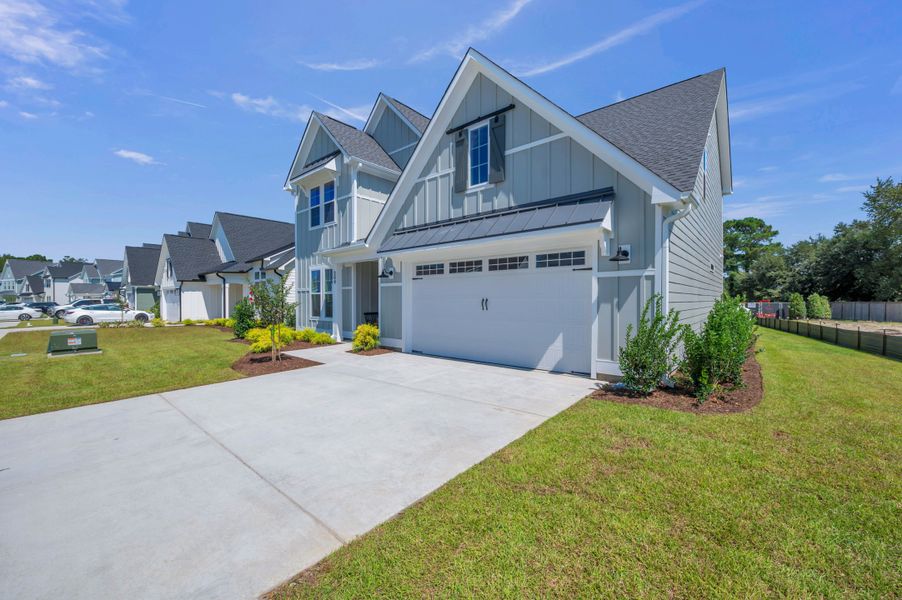 Representative exterior photo of a completed home built from the The Whitley by RobuckHomes in Windwater, Hampstead, NC (Image 34).