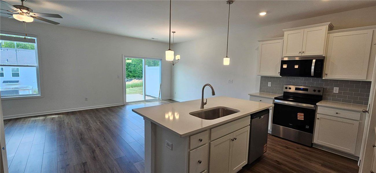 This bright, open concept living space seamlessly This bright, open concept living space seamlessly