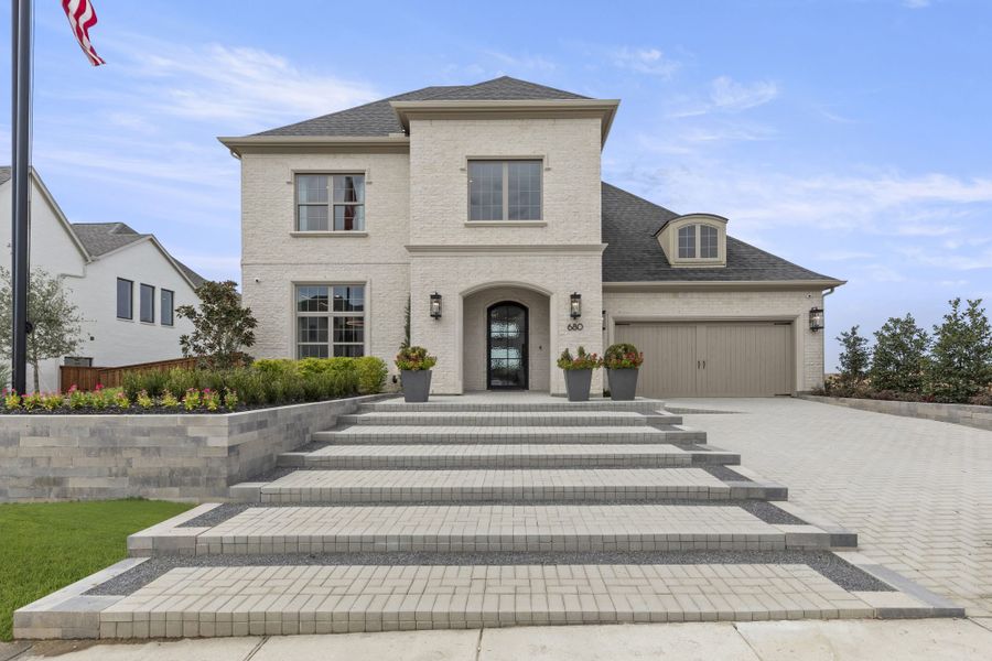 Representative exterior photo of a completed home built from the 5062 by Tradition Homes in The Parks at Wilson Creek, Celina, TX (Image 21). Representative exterior photo of a completed home built from the 5062 by Tradition Homes in The Parks at Wilson Creek, Celina, TX (Image 21).