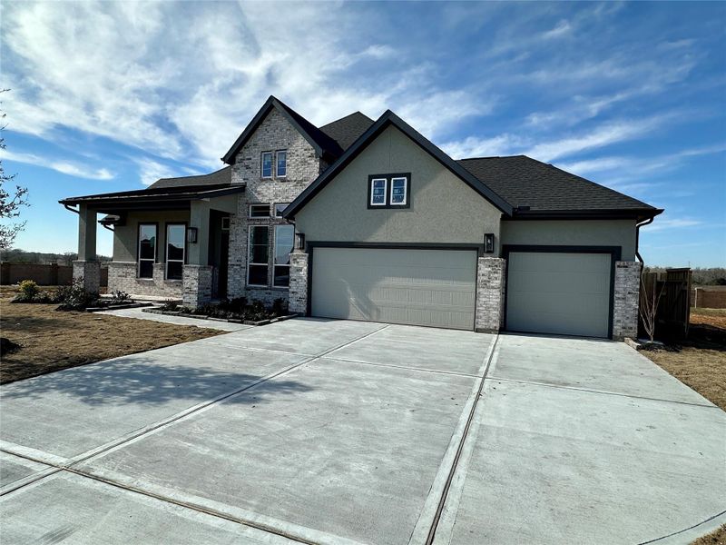 Front exterior of a new home in Briarley, Montgomery, TX, highlighting curb appeal (Image 27).