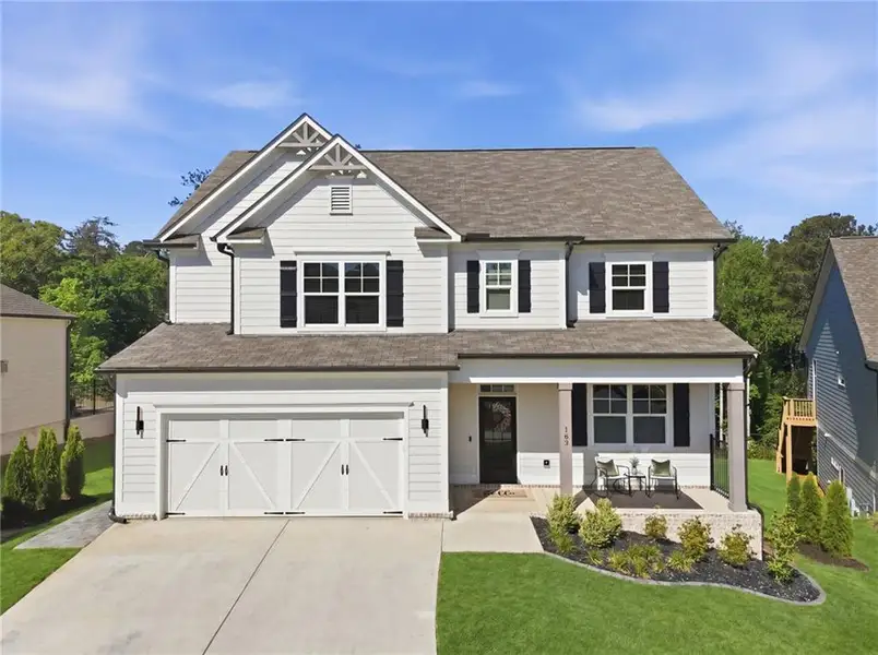 Front exterior of a new home in , Woodstock, GA, highlighting curb appeal (Image 27).