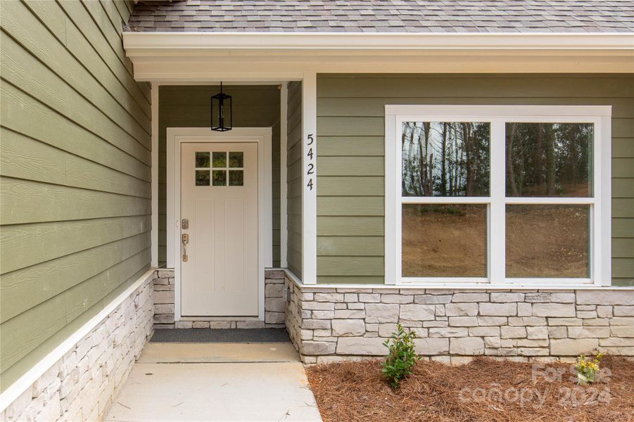 Beautiful entrance with stonework accents