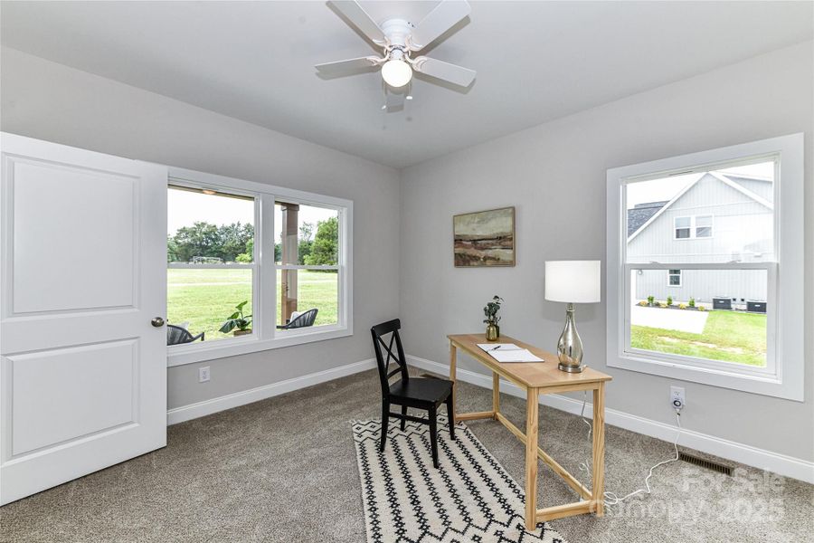 Bedroom currently staged as office with ceiling fan/light & great natural light! Bedroom currently staged as office with ceiling fan/light & great natural light!