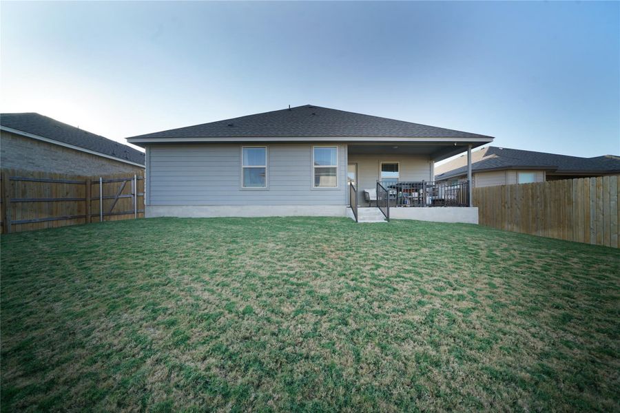 Back of house featuring a patio and a fenced backyard
