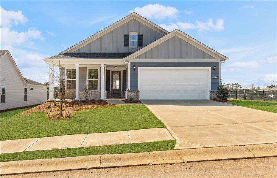 Front exterior of a new home in Del Webb at Lake Oconee, Greensboro, GA, highlighting curb appeal (Image 1). Front exterior of a new home in Del Webb at Lake Oconee, Greensboro, GA, highlighting curb appeal (Image 1).