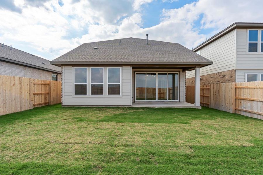 Exterior details and patio area of a home in Lariat, Liberty Hill (Image 24).
