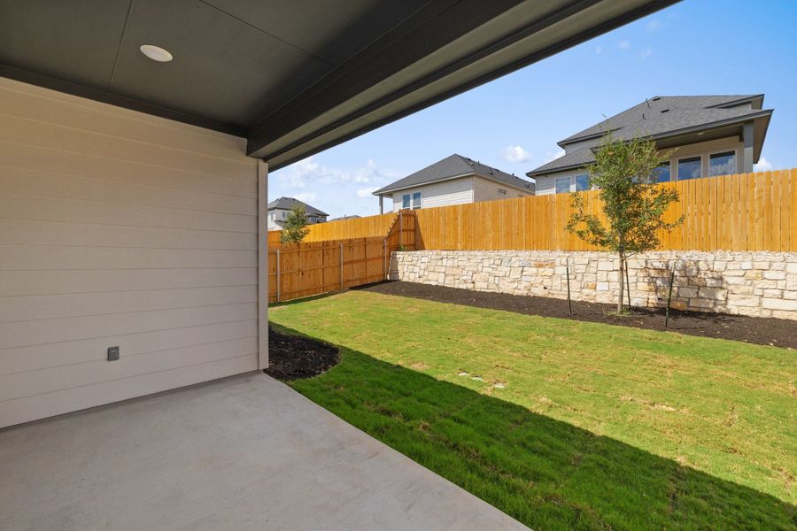 Exterior details and patio area of a home in Heritage, Dripping Springs (Image 28).