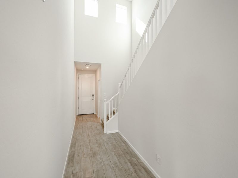 A hallway with white walls. A hallway with white walls.