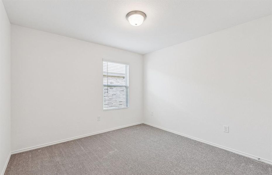 Spacious secondary bedroom with large windows