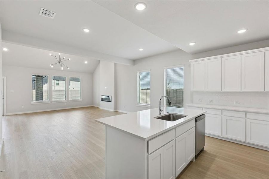 Kitchen in the Stanley II home plan by Trophy Signature Homes – REPRESENTATIVE PHOTO