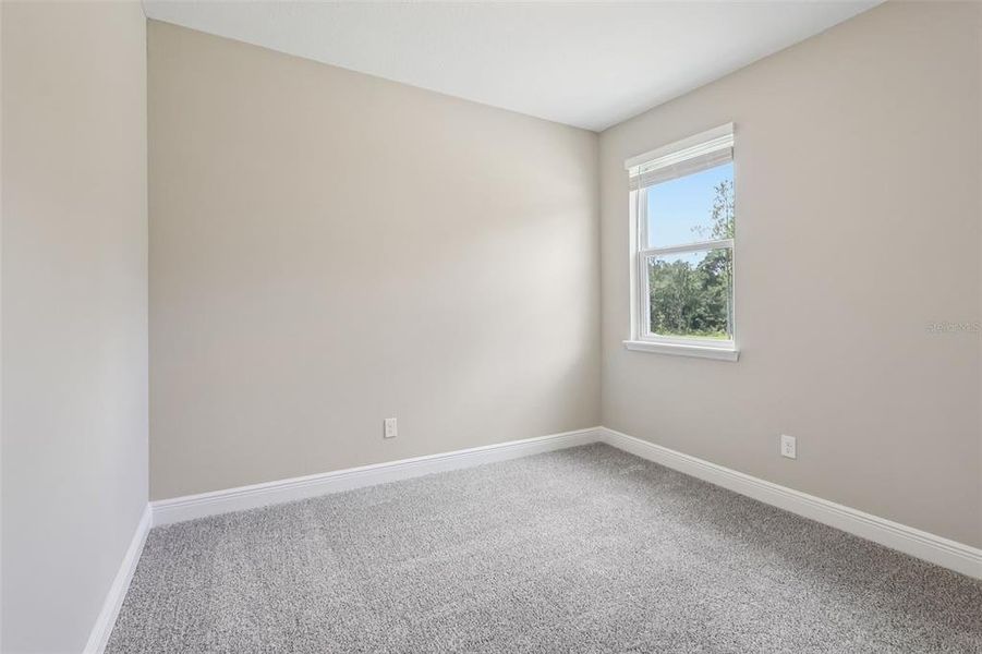 Spacious, unfurnished interior of a new home in Legends Preserve - Signature Series, Daytona Beach (Image 40).