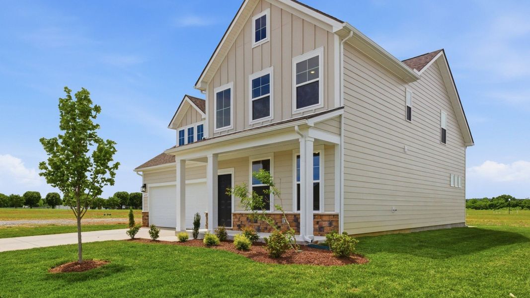 Home Exterior with two types of paneling and two car garage Home Exterior with two types of paneling and two car garage