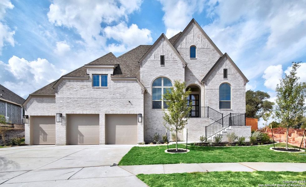 Front exterior of a new home in La Cima: 70ft. lots, San Marcos, TX, highlighting curb appeal (Image 1). Front exterior of a new home in La Cima: 70ft. lots, San Marcos, TX, highlighting curb appeal (Image 1).