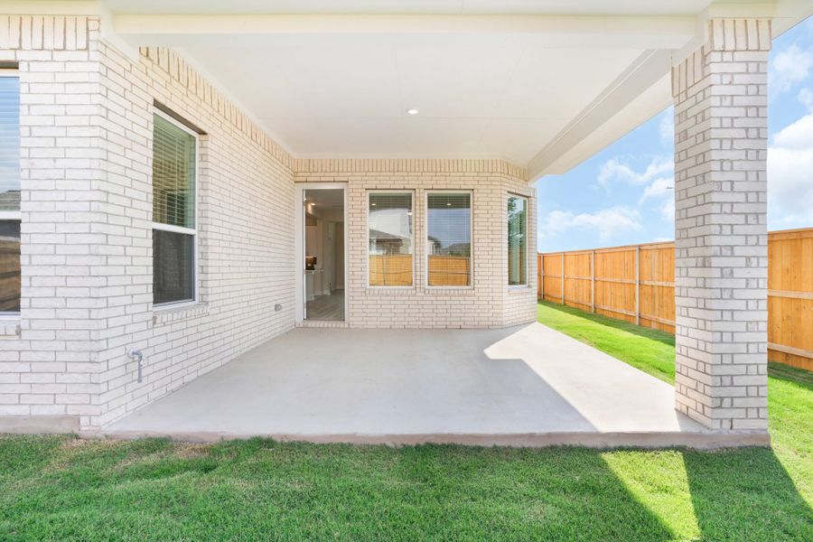 Exterior details and patio area of a home in Lariat, Liberty Hill (Image 4).