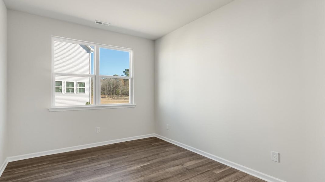 Spacious, unfurnished interior of a new home in Indigo Preserve, Leland (Image 13).