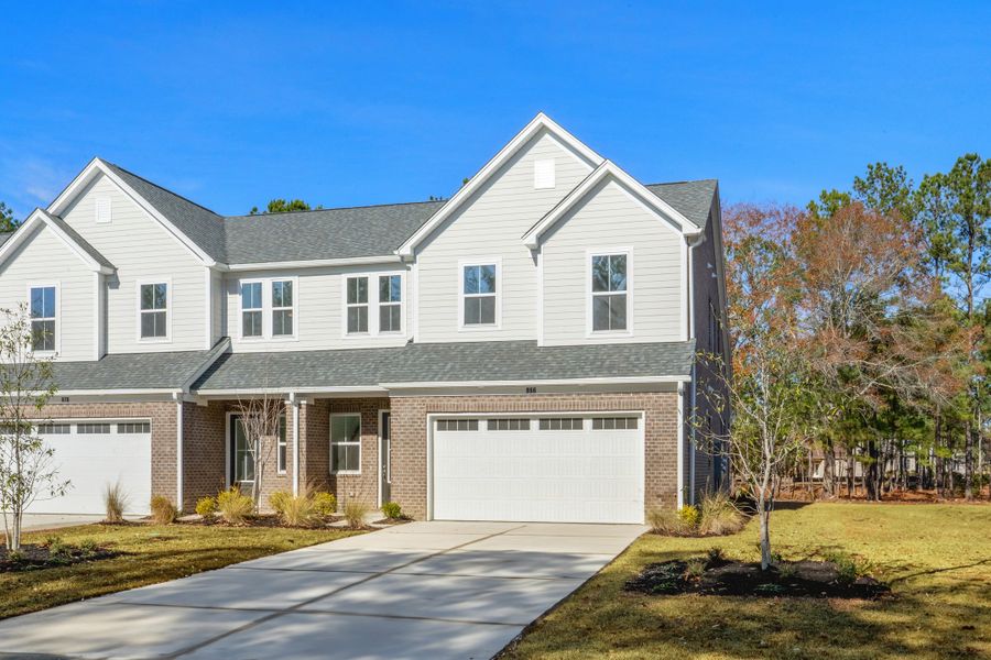 Front exterior of a new home in Long Bay Golf Club, Longs, SC, highlighting curb appeal (Image 16).