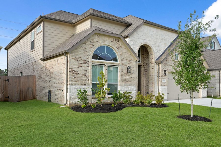 Front exterior of a new home in Morton Creek Ranch, Katy, TX, highlighting curb appeal (Image 14). Front exterior of a new home in Morton Creek Ranch, Katy, TX, highlighting curb appeal (Image 14).