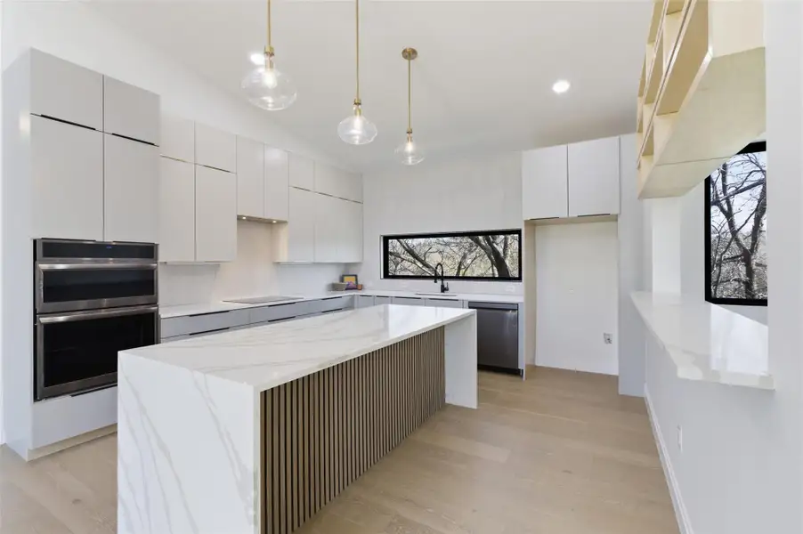 Chef inspired kitchen with stainless steal appliances and plenty of counterspace.