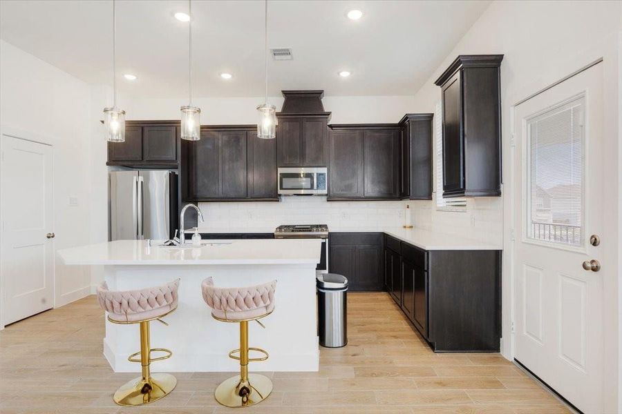 Furnished interior view inside a new home in Meridiana, Iowa Colony (Image 11).