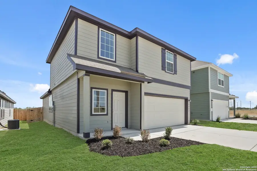 Front exterior of a new home in Hickory Ridge, Elmendorf, TX, highlighting curb appeal (Image 1). Front exterior of a new home in Hickory Ridge, Elmendorf, TX, highlighting curb appeal (Image 1).