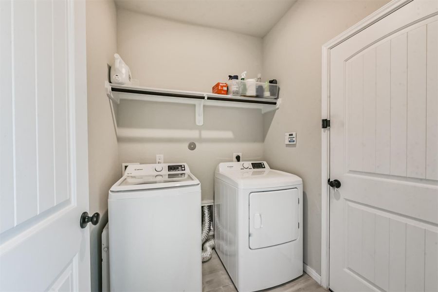 Laundry room with full size washer and dryer. Laundry room with full size washer and dryer.