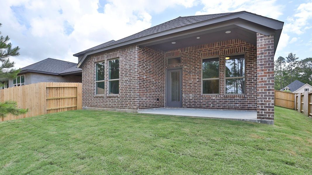 Exterior details and patio area of a home in Woodhavyn, Magnolia (Image 2).