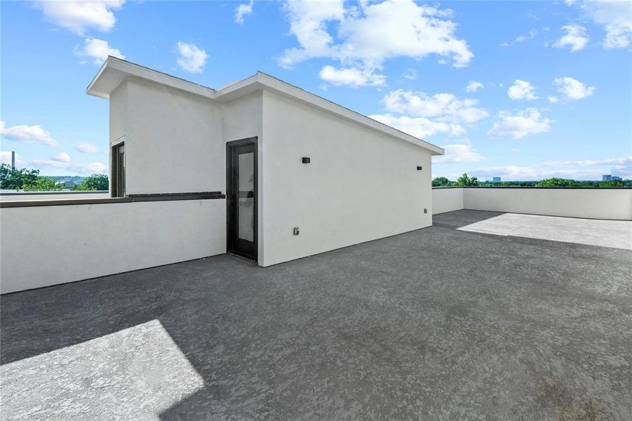 Back of house with a patio and stucco siding Back of house with a patio and stucco siding