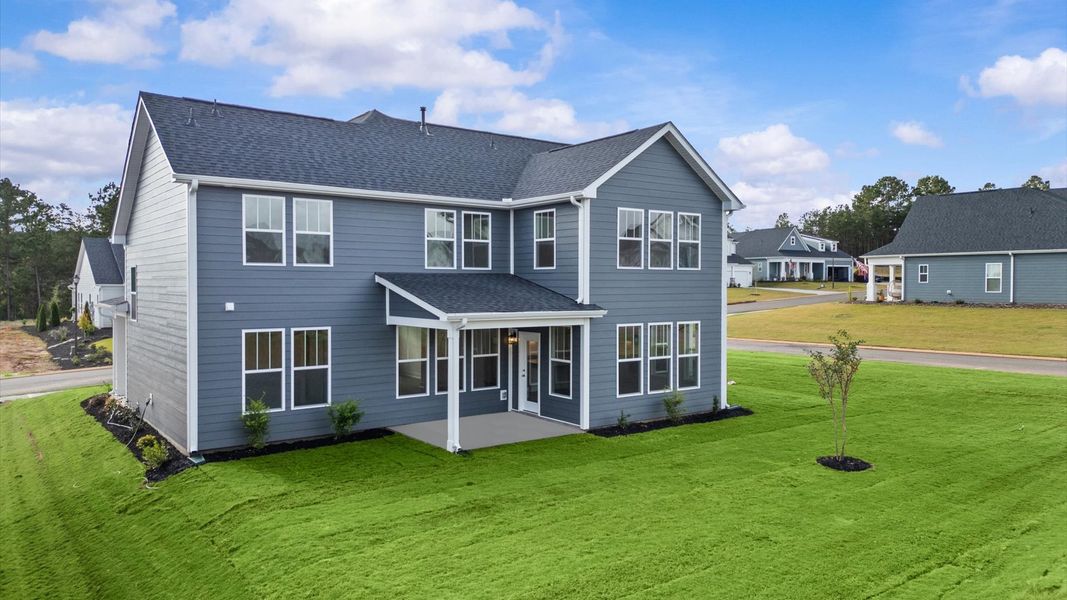 Accomplished exterior with a spacious rear porch that blends comfort and style