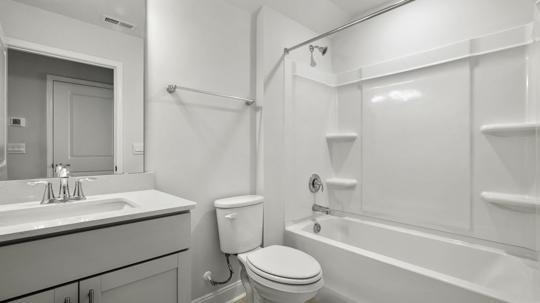 Furnished interior view inside a new home in The Villas at Kinsley, Jamestown (Image 8).