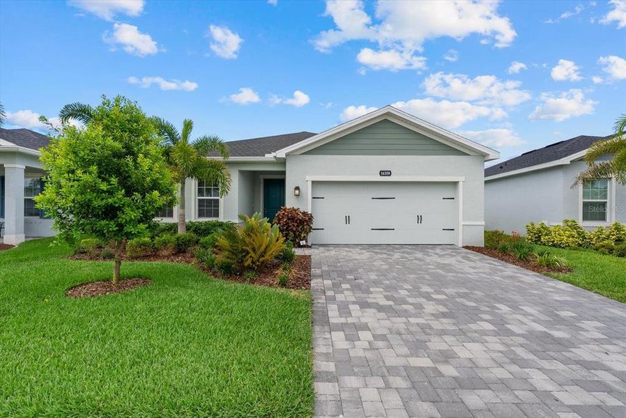 Front exterior of a new home in , Port Charlotte, FL, highlighting curb appeal (Image 23).
