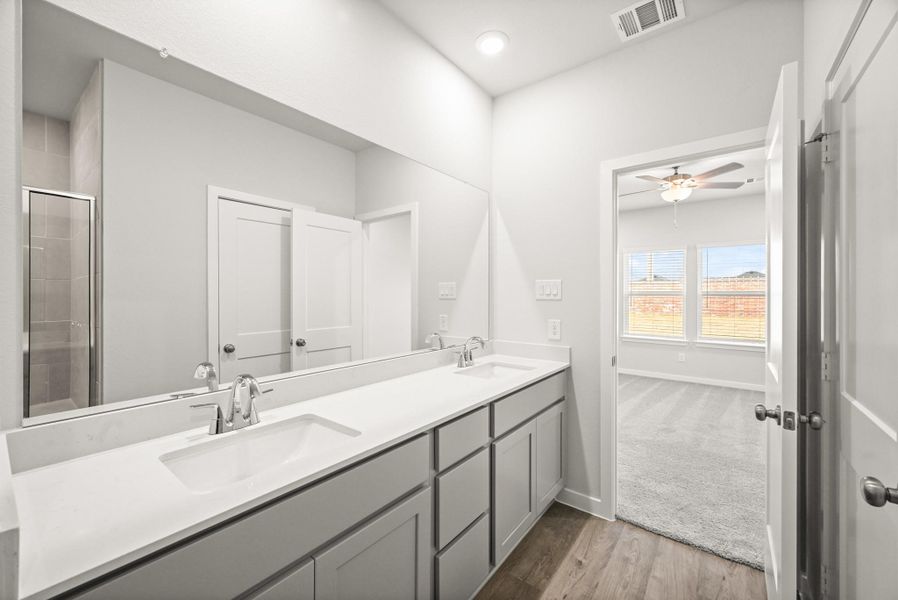 Furnished interior view inside a new home in Sunterra, Katy (Image 12).