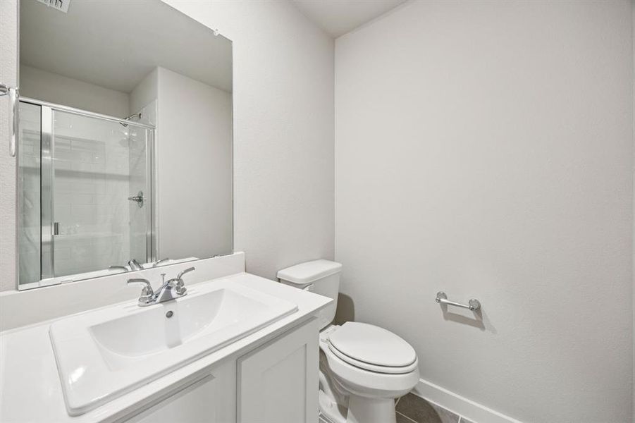 Bathroom in the Hayden home plan by Trophy Signature Homes – REPRESENTATIVE PHOTO