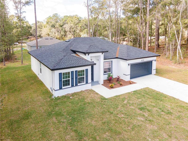 Front exterior of a new home in , Citrus Springs, FL, highlighting curb appeal (Image 22).