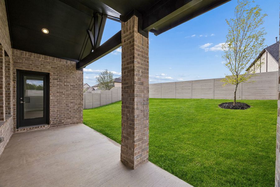 Exterior details and patio area of a home in Painted Tree Woodland West, McKinney (Image 3).