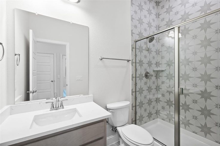 Full bath with vanity and a stall shower Full bath with vanity and a stall shower