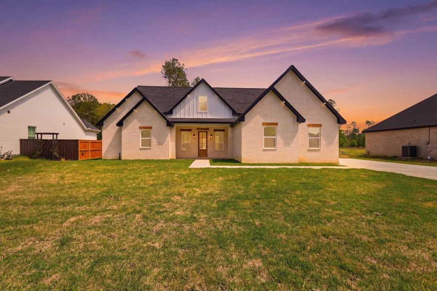 Front exterior of a new home in , Dayton, TX, highlighting curb appeal (Image 20).