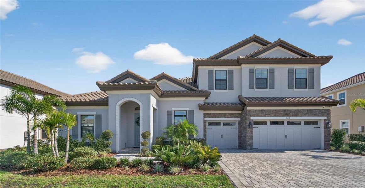 Front exterior of a new home in Creek Ridge Preserve, Lithia, FL, highlighting curb appeal (Image 25). Front exterior of a new home in Creek Ridge Preserve, Lithia, FL, highlighting curb appeal (Image 25).