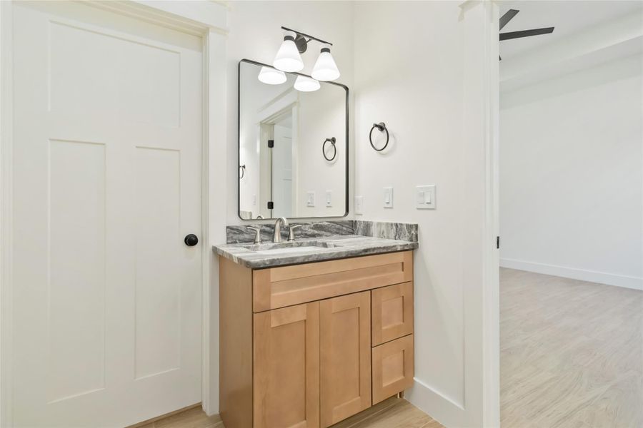 Separate vanity in primary ensuite with access to walk-in closet Separate vanity in primary ensuite with access to walk-in closet