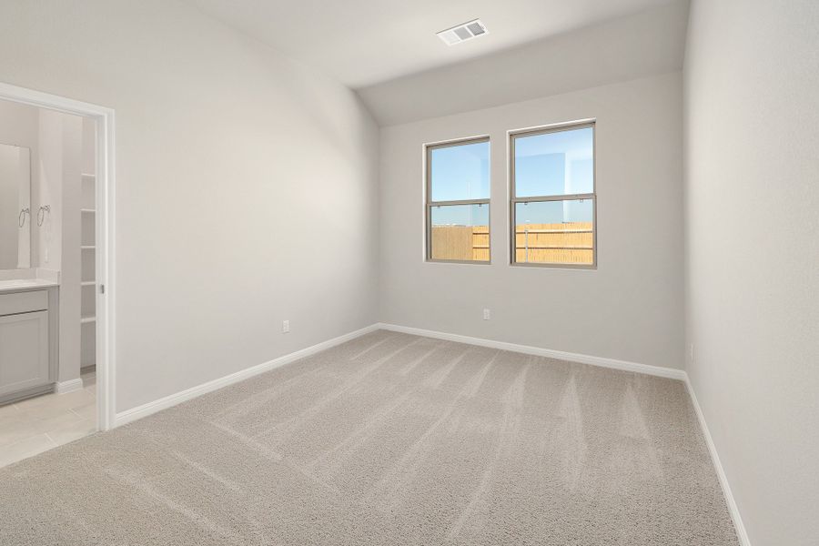 Primary Bedroom in the Ash home plan by Trophy Signature Homes – REPRESENTATIVE PHOTO