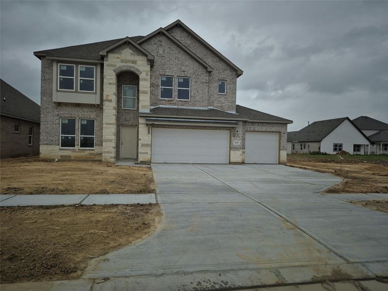 Front exterior of a new home in Foxtail Palms, Manvel, TX, highlighting curb appeal (Image 1). Front exterior of a new home in Foxtail Palms, Manvel, TX, highlighting curb appeal (Image 1).