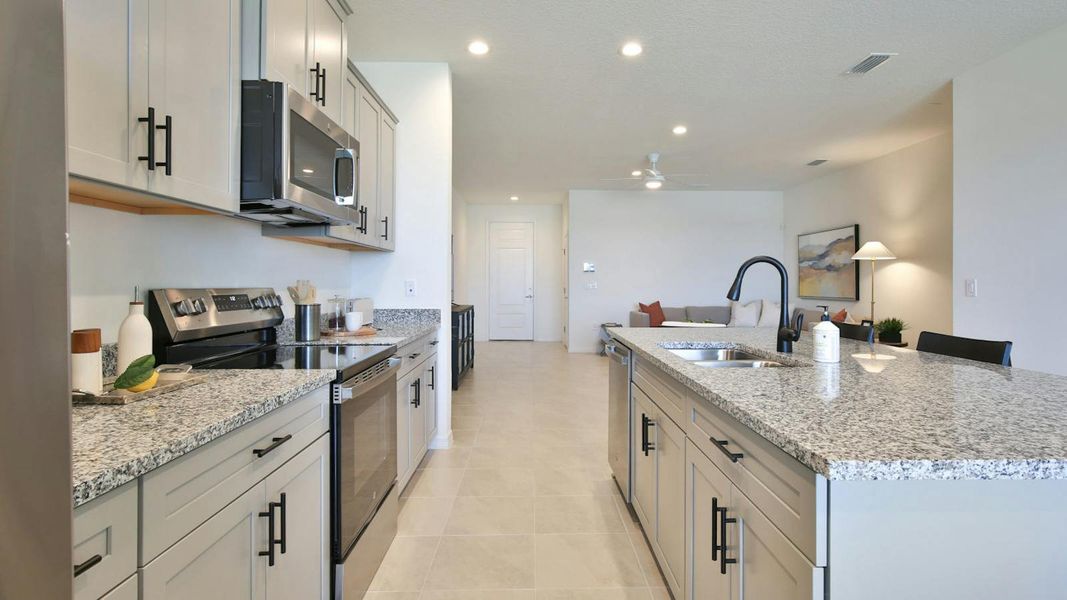 Furnished interior view inside a new home in Palm Grove Real Estate and Homes for Sale in Lakewood Ranch, FL - Neal Communities, Lakewood Ranch (Image 27).